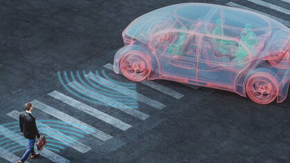 A 3D rendering shows a businessman who walks towards a futuristic looking car. Two-way signals, which are sent out by the car and the man, indicate smart communication between humans and future technology.